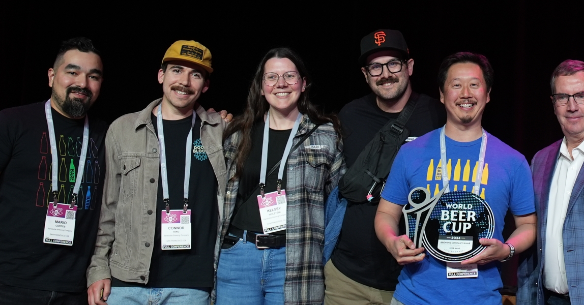 Receiving their Silver on the World Beer Cup stage, five BareBottle Brewing team members can't stop grinning